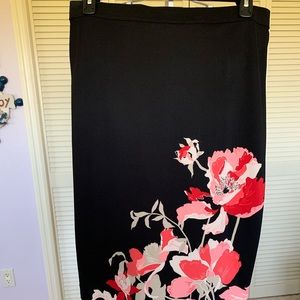 This beautiful black skirt with the floral print is a size large